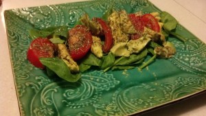 Caprese salad with spinach, avocado, tomato, and bouquet garnier