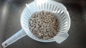 Draining cashews in a strainer